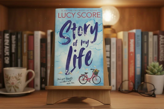 Book cover of 'Storm of My Life' by Lucy Score with a bicycle illustration on a light blue background.