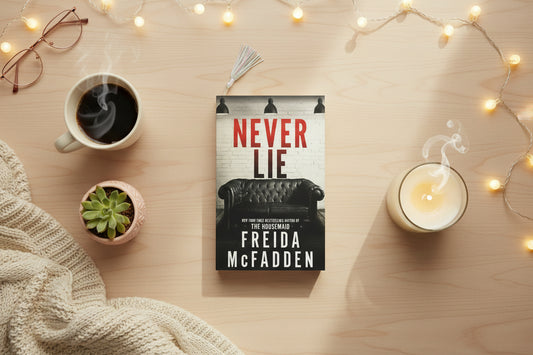 Book titled 'Never Lie' by Freida McFadden on a patterned surface
