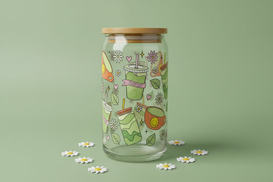 Glass jar with wooden lid and colorful illustrations on a marble surface